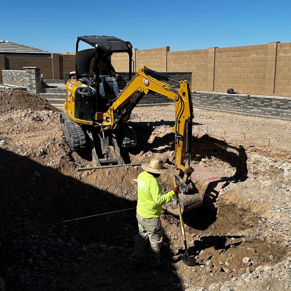 employees excavating a pool